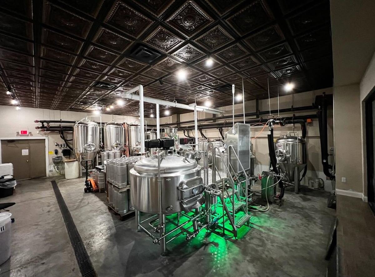 The Half Wall brewhouse — fermenters and brew kettle